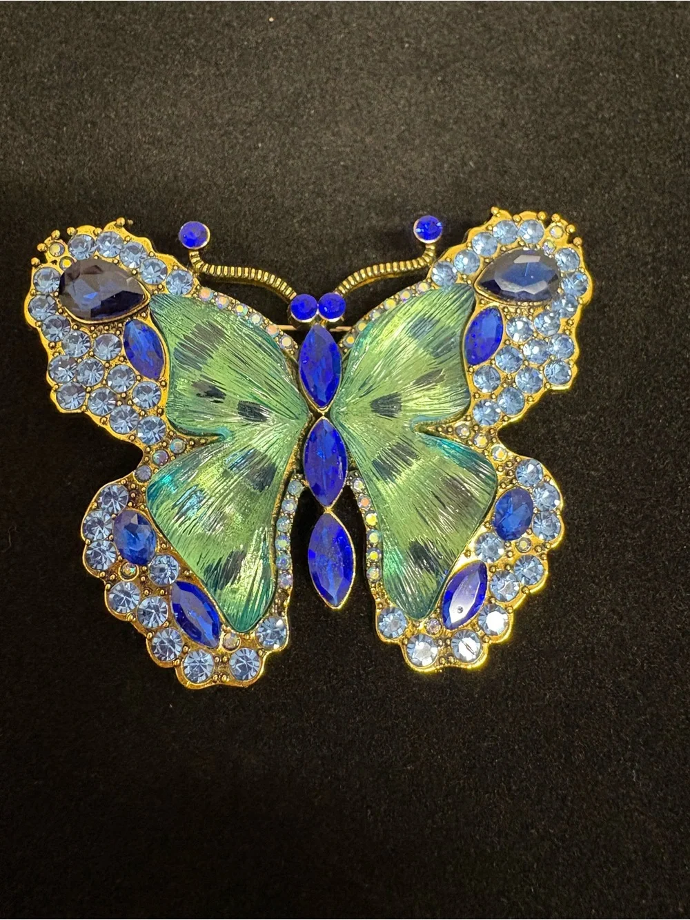 Large Blue, green, and goldtone butterfly brooch.